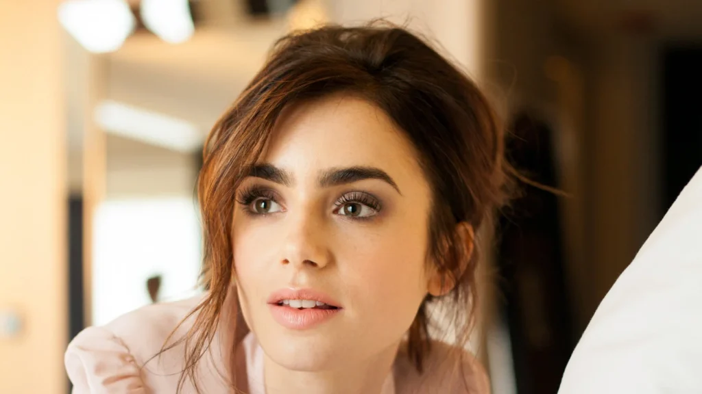 Lily Collins smiles in a candid moment, showcasing the actress's ability to navigate the delicate balance between her thriving career and a private, serene personal life.