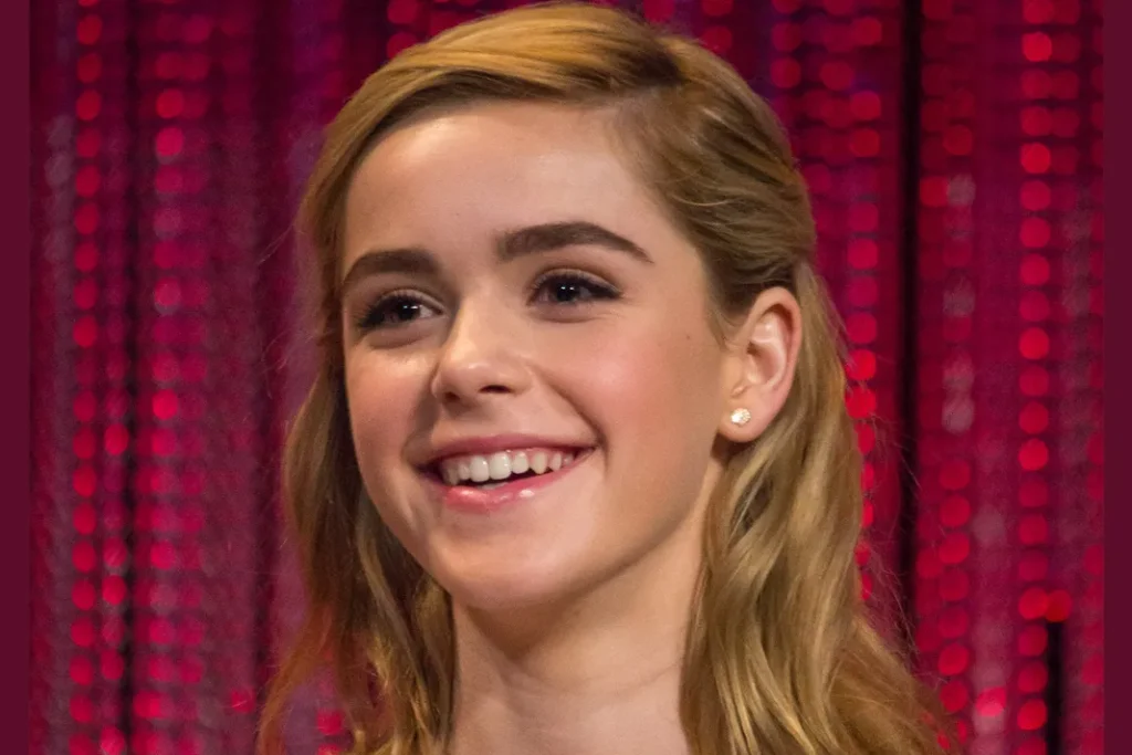 Image featuring Kiernan Shipka, a digital fashion trendsetter, showcasing her unique style on social media, influencing and inspiring followers worldwide.