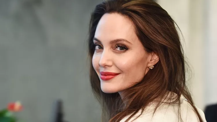 An image encapsulating Angelina Jolie's cultural influences and industry connections, highlighting her impact on the diverse landscape of the entertainment world.
